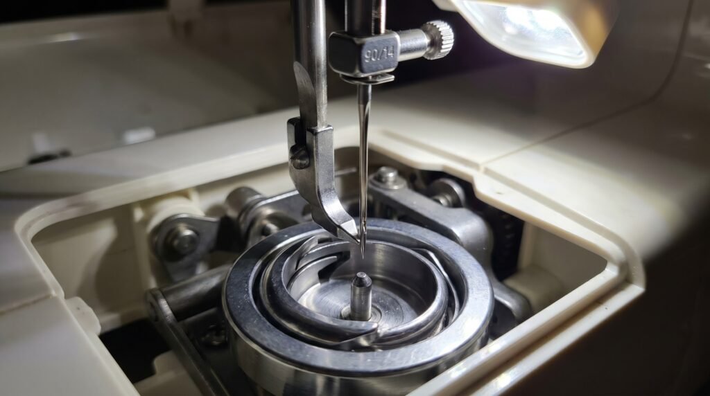 Rotary hook point aligned with size 90/14 sewing machine needle at the scarf groove inside the hook race